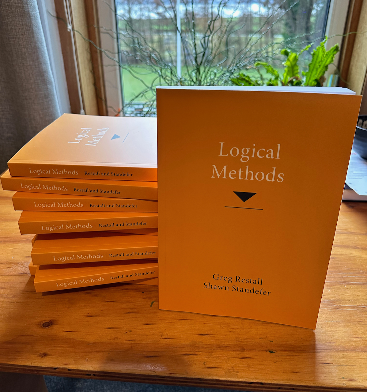 A Stack of Copies of the book Logical Methods, written by Greg Restall and Shawn Standefer, MIT Press, 2023